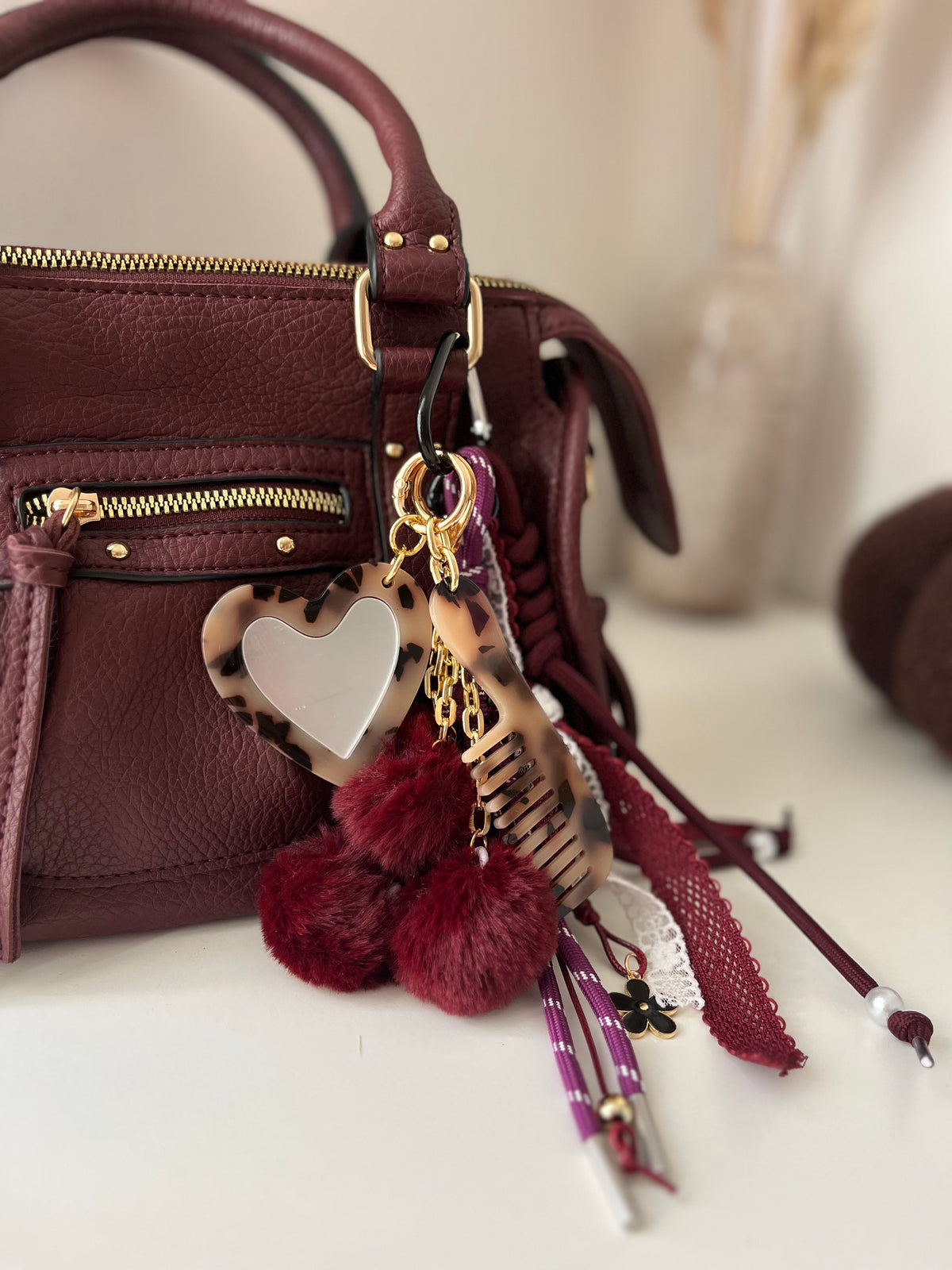 Grigri pompom peigne et miroir bordeaux & léopard